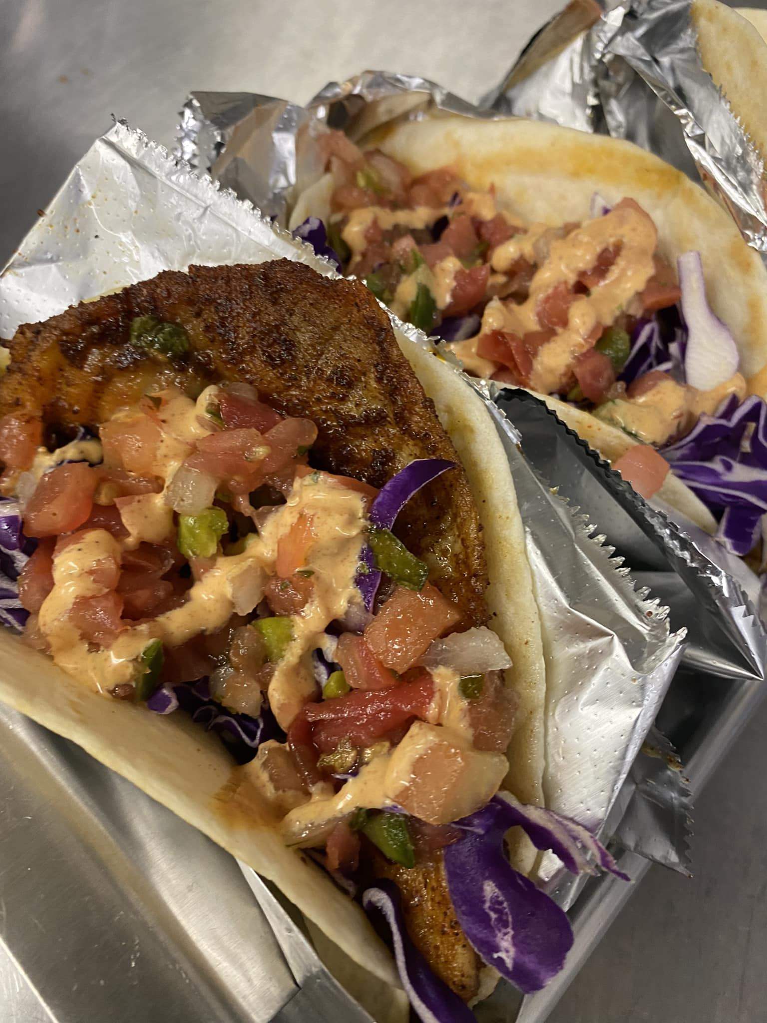 Fresh fish tacos with cabbage slaw and lime